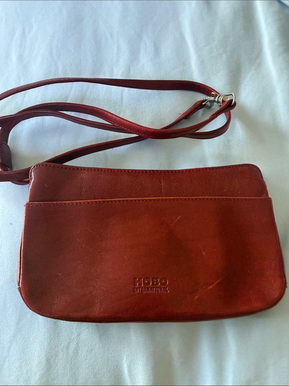 HOBO Rust Red Leather Crossbody with Embossed Logo